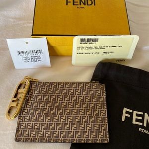 Authentic Fendi brown embossed leather coin purse with key ring